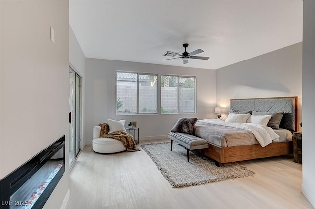 bedroom featuring ceiling fan and light wood-type flooring