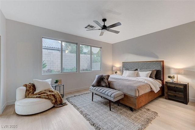 bedroom with ceiling fan and light hardwood / wood-style floors