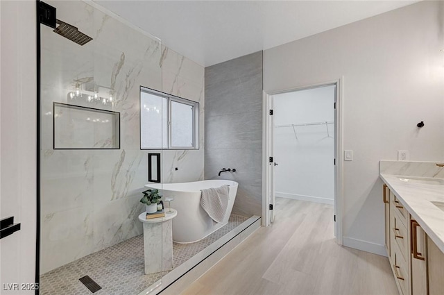 bathroom with vanity and separate shower and tub