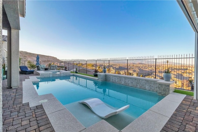 view of swimming pool featuring a mountain view