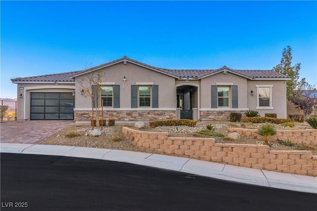 view of front of home with a garage