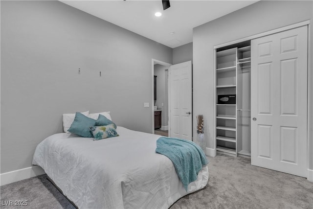 bedroom featuring carpet flooring, ceiling fan, and a closet