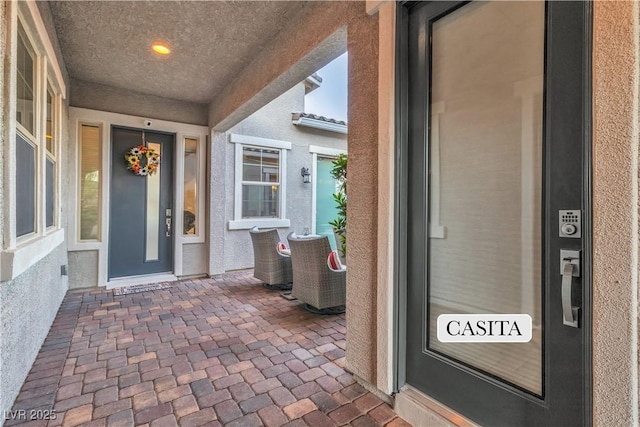 doorway to property featuring covered porch