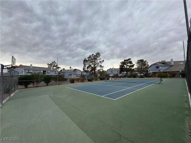 view of sport court with basketball hoop