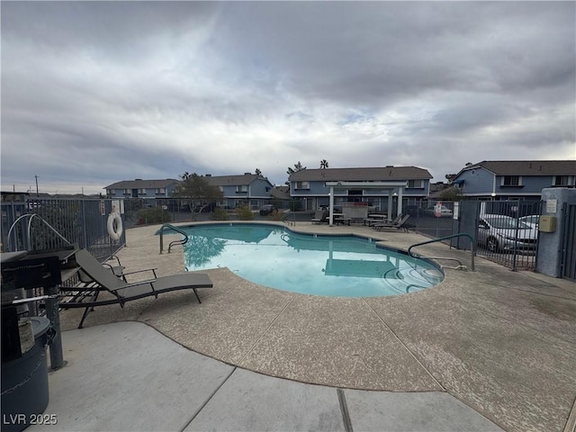 view of swimming pool with a patio