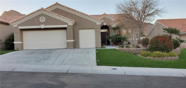 view of front of home with a front yard and a garage