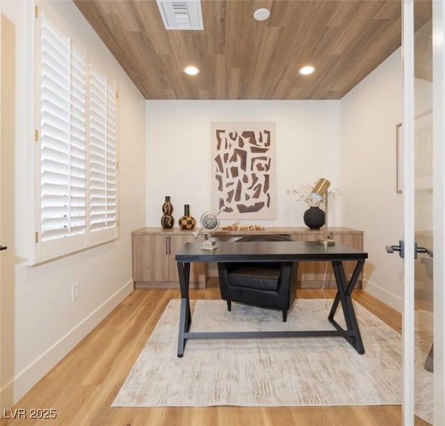 office space featuring light hardwood / wood-style floors and wood ceiling