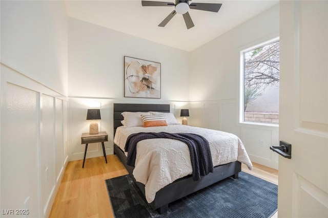 bedroom with light hardwood / wood-style flooring and ceiling fan