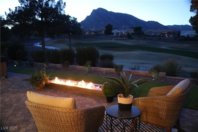 water view with a mountain view and an outdoor fire pit