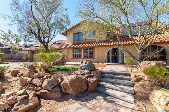 view of front of home with solar panels