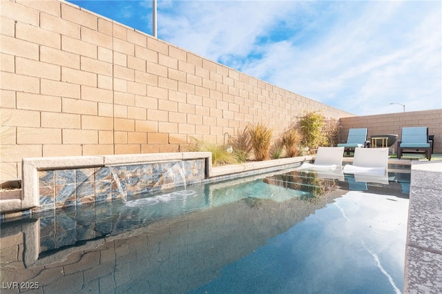 view of pool featuring pool water feature