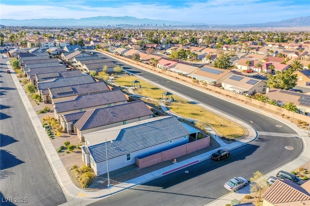 birds eye view of property with a mountain view