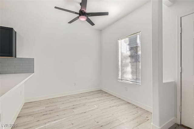 interior space featuring light wood-type flooring, a wealth of natural light, and ceiling fan