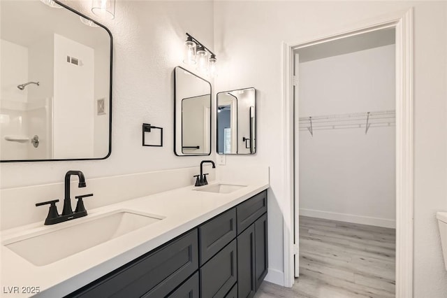 bathroom featuring hardwood / wood-style floors and vanity