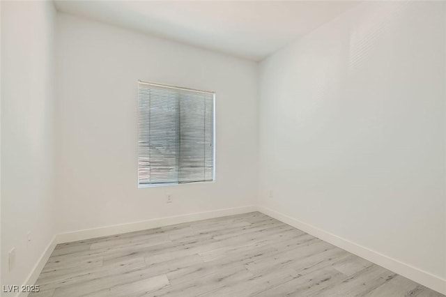 spare room featuring light hardwood / wood-style flooring