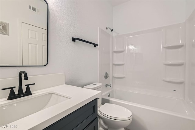 full bathroom featuring shower / washtub combination, vanity, and toilet