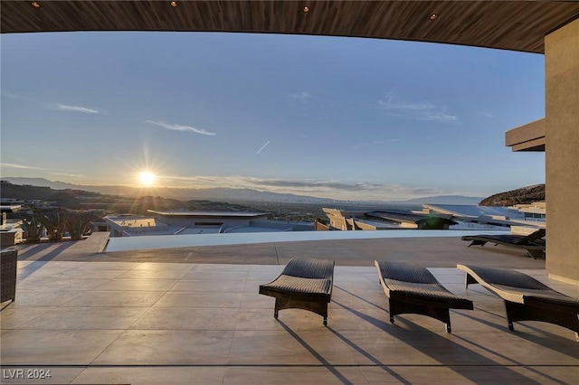 patio terrace at dusk with a mountain view