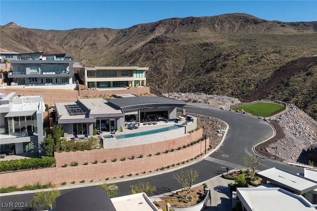 back of property with a mountain view