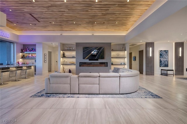 living room featuring bar and wood ceiling