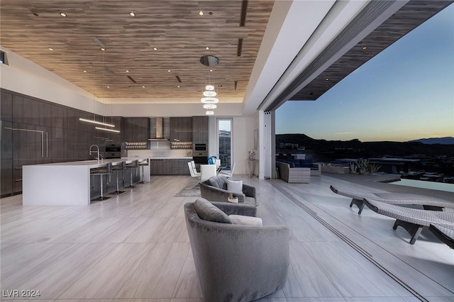 interior space featuring light tile patterned flooring and wooden ceiling