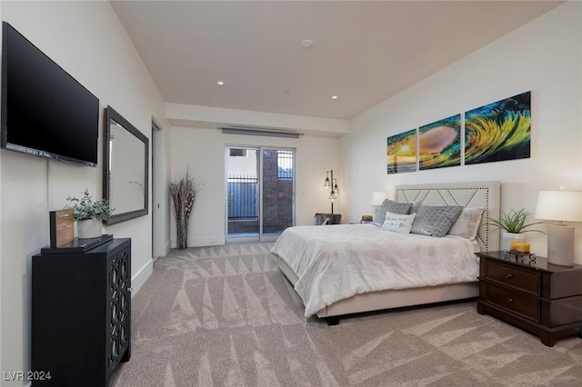 bedroom featuring access to exterior and light colored carpet