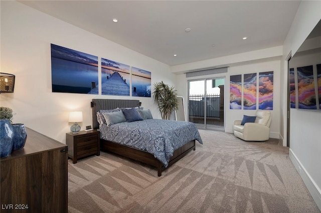 carpeted bedroom featuring access to exterior