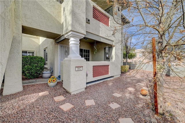 view of side of property featuring a balcony