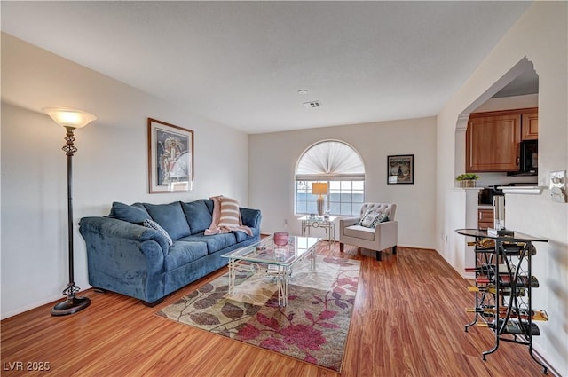 living room with light hardwood / wood-style flooring