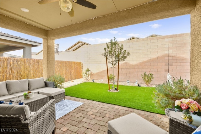 view of patio featuring ceiling fan and an outdoor living space