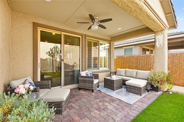 view of patio with ceiling fan and an outdoor living space