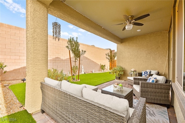 view of patio / terrace featuring ceiling fan and an outdoor living space