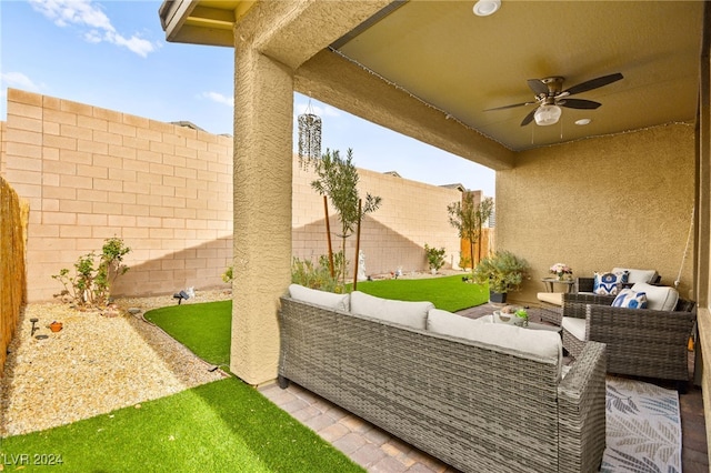 view of patio / terrace featuring ceiling fan and an outdoor living space