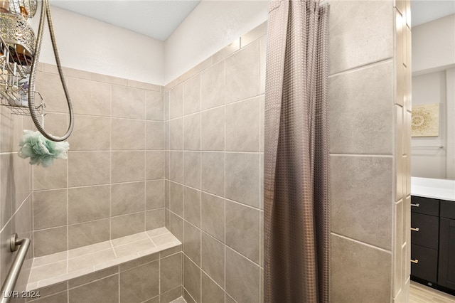 bathroom with vanity and walk in shower