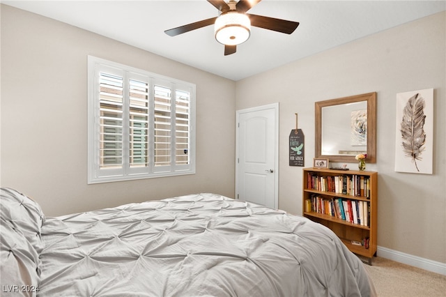 carpeted bedroom featuring ceiling fan