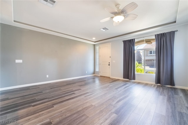 unfurnished room featuring hardwood / wood-style flooring and ceiling fan