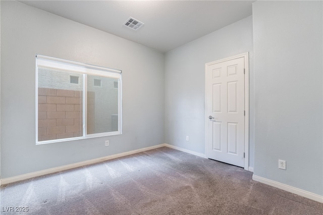 unfurnished room with carpet flooring