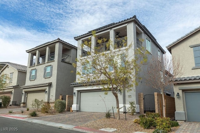 view of front of house with a balcony and a garage