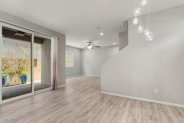 empty room featuring light hardwood / wood-style floors and ceiling fan