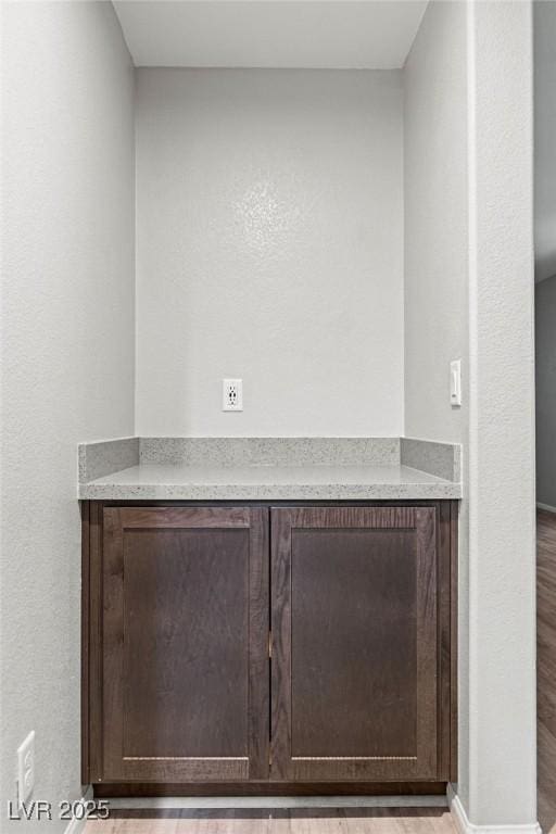 interior details featuring hardwood / wood-style flooring