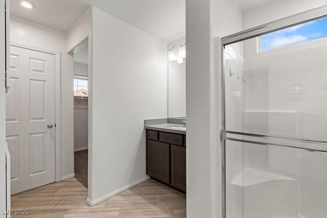 bathroom featuring vanity and walk in shower