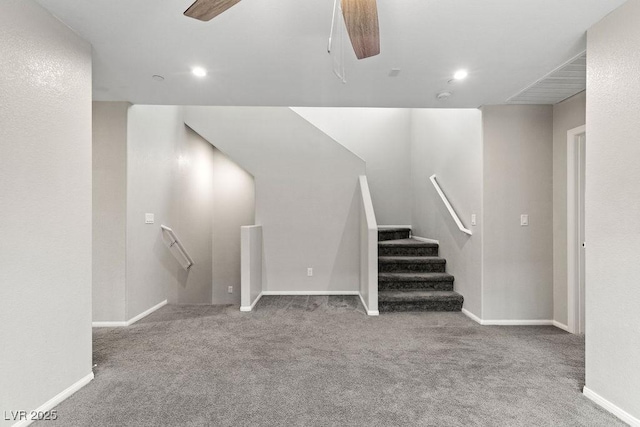 staircase featuring carpet floors and ceiling fan