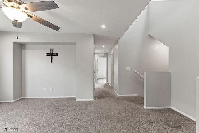 empty room with light carpet and ceiling fan