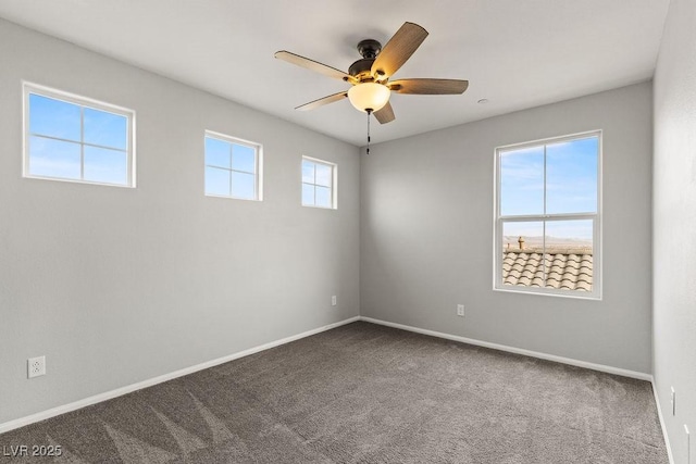 unfurnished room featuring ceiling fan and carpet floors