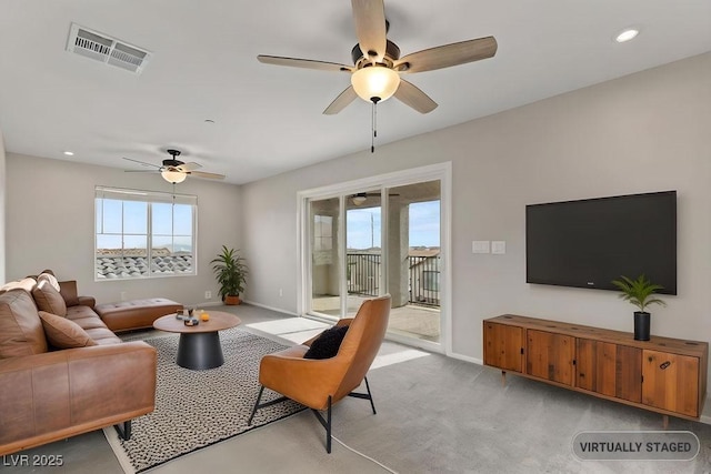 living room with light colored carpet and ceiling fan