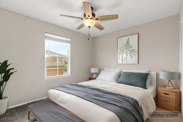 carpeted bedroom featuring ceiling fan