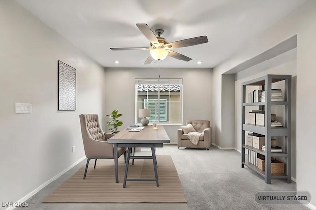 sitting room with carpet and ceiling fan