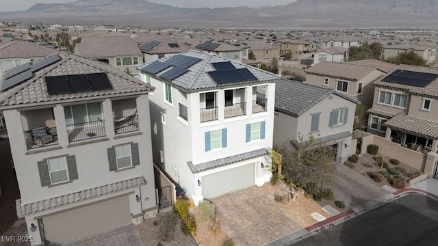 birds eye view of property with a mountain view