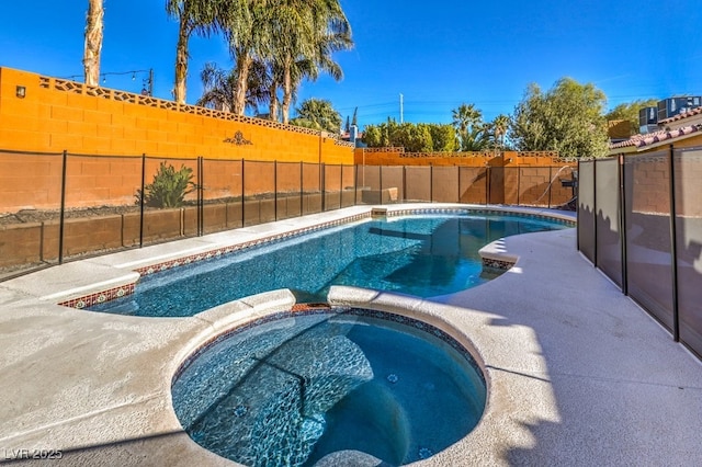 view of swimming pool with an in ground hot tub