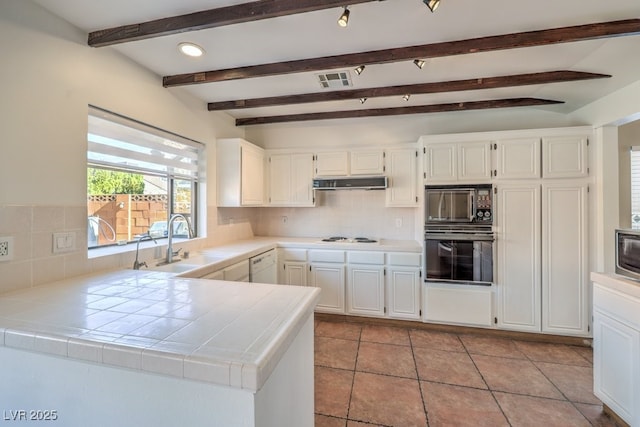 kitchen with white cabinetry, sink, beamed ceiling, tile countertops, and black appliances