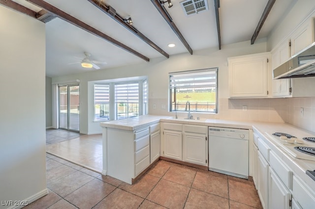 kitchen featuring beam ceiling, white cabinetry, white appliances, and sink